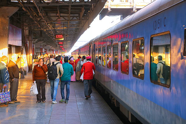 People walking at Jaipur Junction railway station in Rajasthan, stock photo