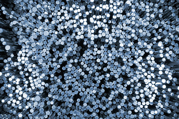 istock Shiny metal round bars. Blue tinted industrial background 525741062