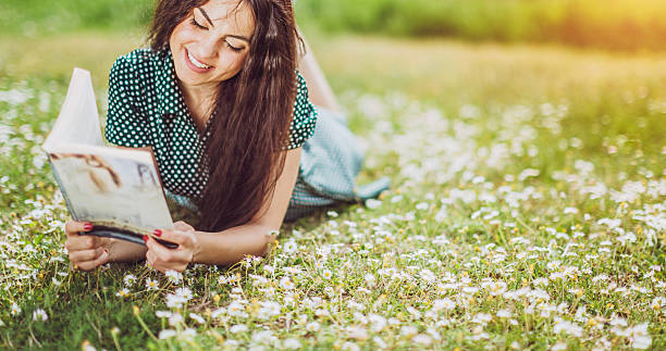 istock beautiful girl reading a book 525741214