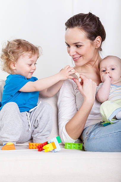 istock Mother and babies during free time 525750897