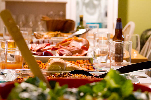 Thanksgiving Meal Table is set for Thanksgiving meal with food. leftovers photos stock pictures, royalty-free photos & images