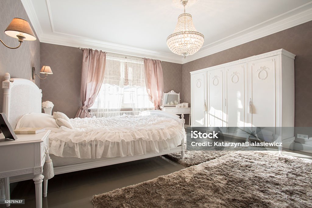Enormous bedroom Enormous luxury old fashioned bedroom with crystal chandelier Bedroom Stock Photo
