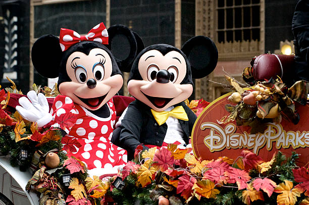 Minnie and Mickey Mouse ride Disney Parks float Philadelphia, PA, USA - November 27, 2014: Disney's Mickey and Mini Mouse participate in the Thanksgiving Day Parade in Philadelphia.  Disney Characters stock pictures, royalty-free photos & images
