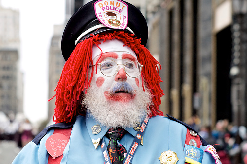 Philadelphia, PA, USA - November 27, 2014: This clown-police officer is one of the participants of the annual Philly 6abc Dunkin' Donuts Thanksgiving Day Parade.