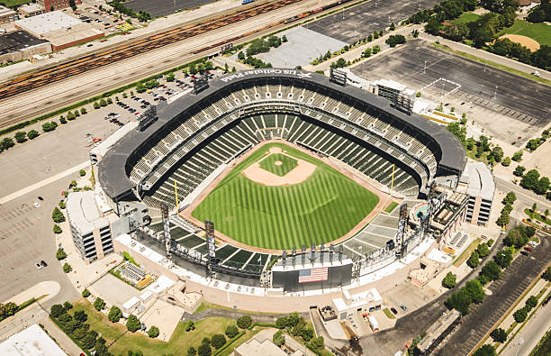 U.S Cellular Field stadium aerial view in chicago Chicago, Illinois, USA - July 12, 2013: Aerial view of the U.S Cellular Field stadium in Chicago. This arena is the house of the Chicago White Sox MLB baseball team. The stadium is situated on the South of Chicago. The image has been taken from an Helicopter . major league baseball stock pictures, royalty-free photos & images