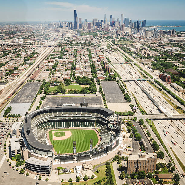 U.S Cellular Field stadium aerial view in chicago Chicago, Illinois, USA - July 12, 2013: Aerial view of the U.S Cellular Field stadium in Chicago. This arena is the house of the Chicago White Sox MLB baseball team. The stadium is situated on the South of Chicago. The image has been taken from an Helicopter . major league baseball stock pictures, royalty-free photos & images