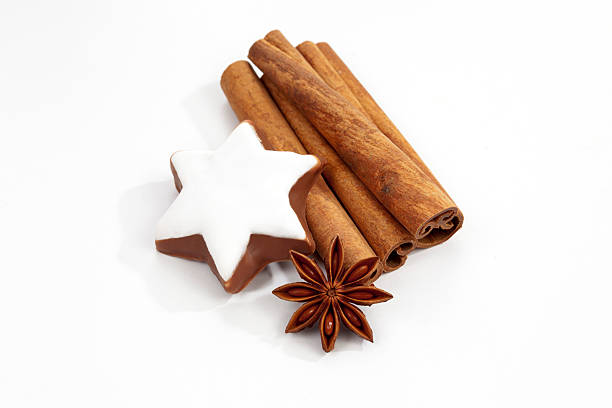 istock Christmas decoration, anise and cinnamon star on white background 525754261