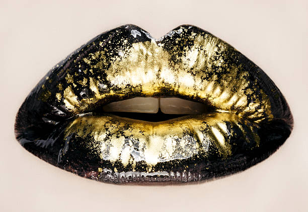 Black and gold lips close up stock photo