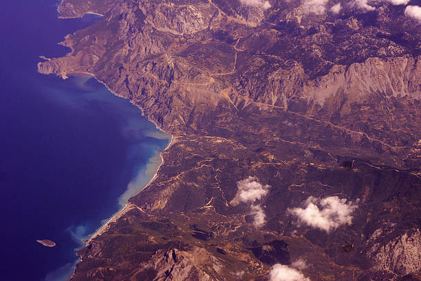 istock view from the plane of mountains and sea 525754379
