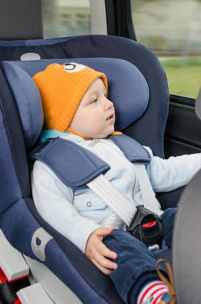 istock Cute boy sitting in the car seat 525754999