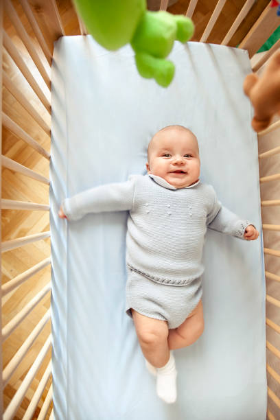 istock Baby boy in his crib 525755369