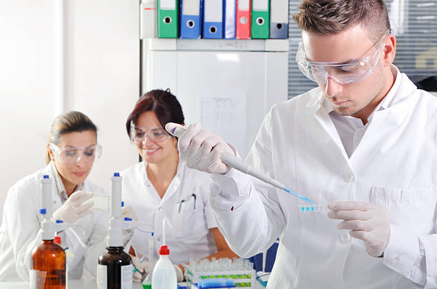 istock Attractive young PhD students scientists observing in the laboratory 525755501