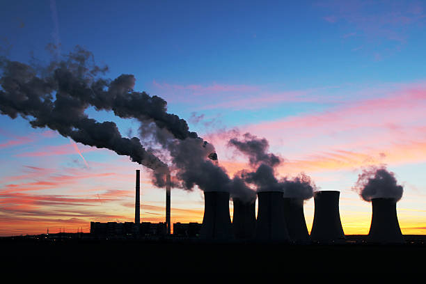 dramatic sunset over coal power plant stock photo
