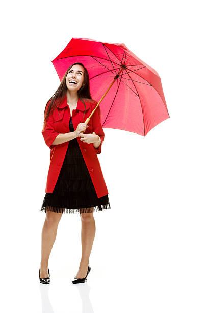 istock Cheerful woman holding umbrella 525756285