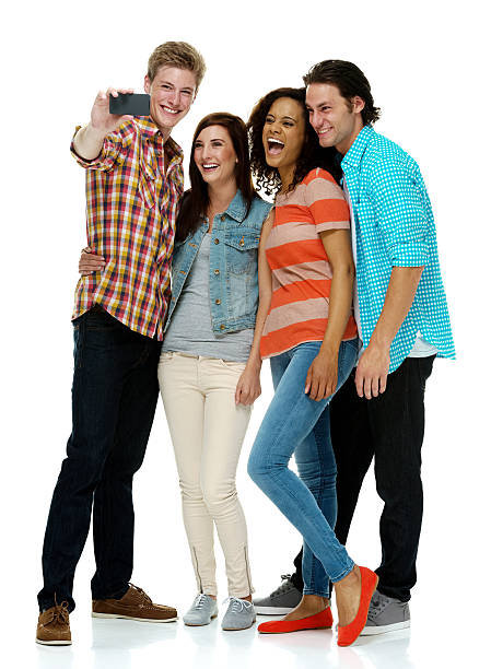 istock Four smiling people taking a selfie 525756339