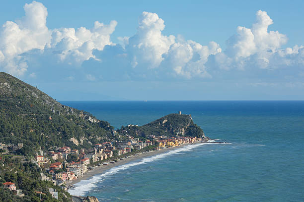 View over sea and mountainside with village View over sea and mountainside with village and road below varigotti stock pictures, royalty-free photos & images