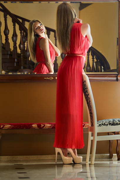 istock Girl looks in mirror 525756993