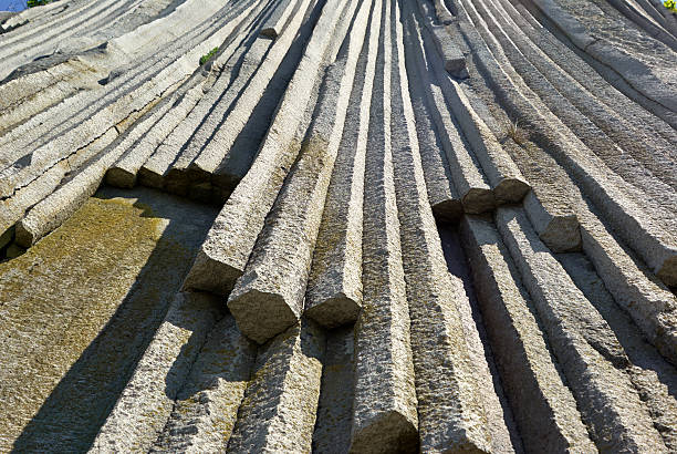 Wall natural stone Volcanic rocky formation. basalt lava column, giants causeway, Stolbchaty Cape; Kunashir island in Kuril islands chain kunashir island stock pictures, royalty-free photos & images