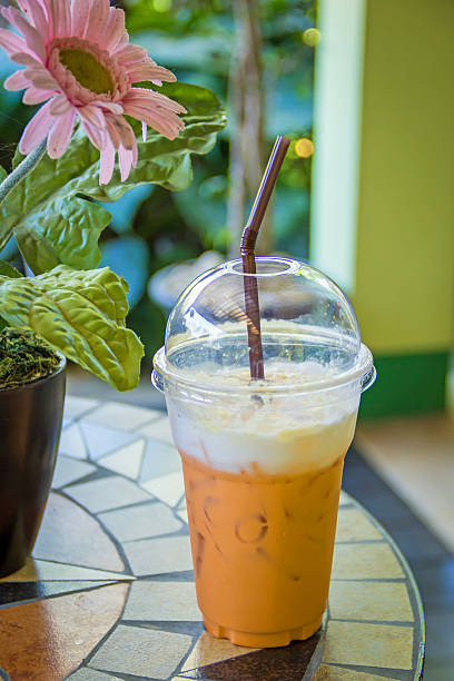 istock take-home cup of ice coffee on table. 525757707