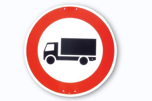 Road sign, motor lorry, close-up