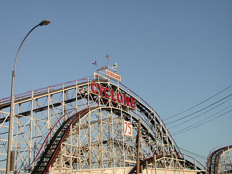 New York City, NY, USA - April 27, 2003: View of the famed wooden roller coaster, The Cylcone, on its 75th anniversary year. In Coney Island, Brooklyn.