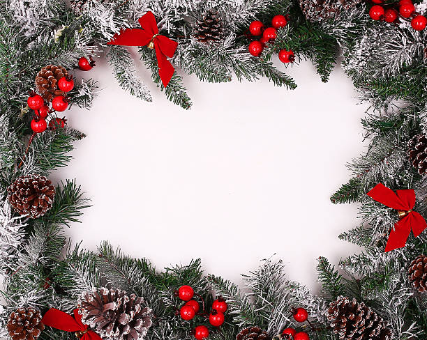 istock Christmas decorative border with pine cones and holly berries 525774891