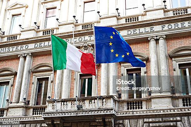 Flag Of Italy And United Europe On Government In Rome Stock Photo - Download Image Now