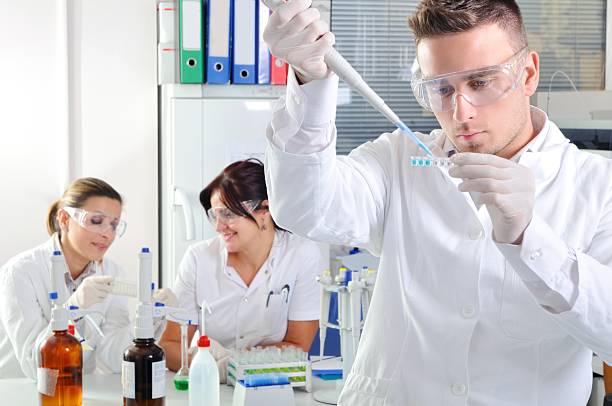 istock Attractive young PhD students scientists observing in the laboratory 525786261