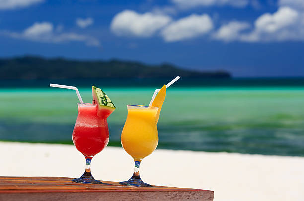 istock mango and watermelon cocktails on beach 525787797