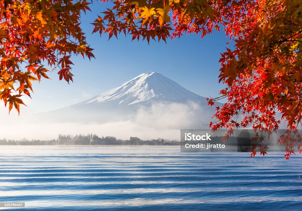 Mountain Fuji with morning fog in autumn Mountain Fuji and Kawaguchiko lake with morning fog and maple leaves in autumn season Asia Stock Photo