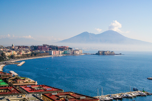 Naples, View From Posillipo with Vesuvius, view of the bay under blue sky.