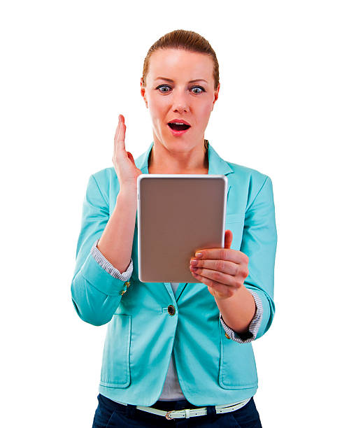 istock smiling woman with tablet touching in shock 525792861