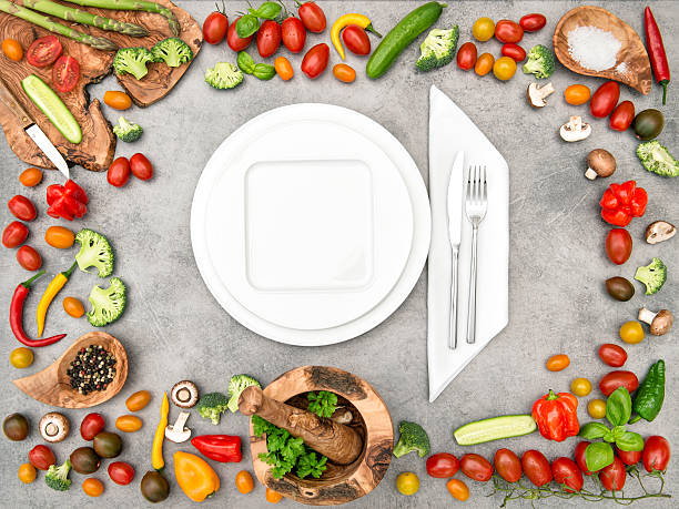 istock Table setting with fresh vegetables. Healthy food 525800086