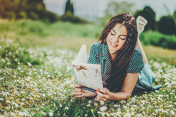istock young woman lying on meadow 525800846