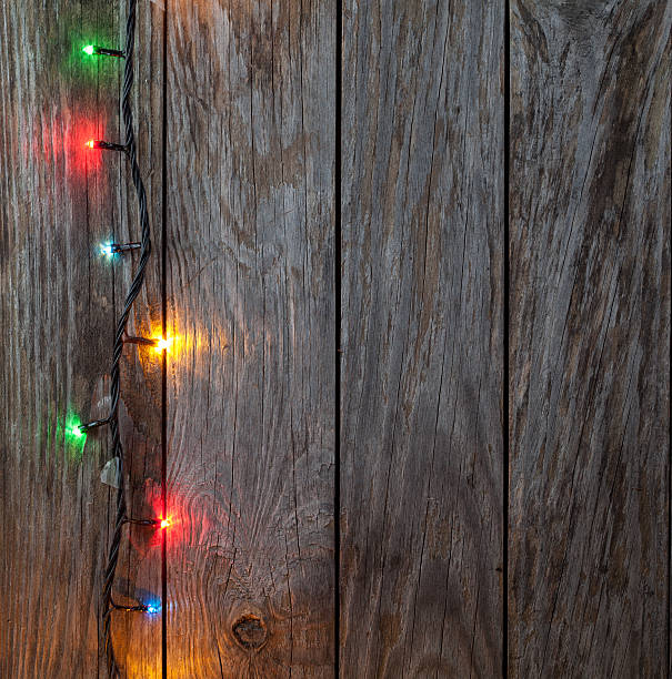istock Christmas background. planked wood with lights and free text spa 525801077