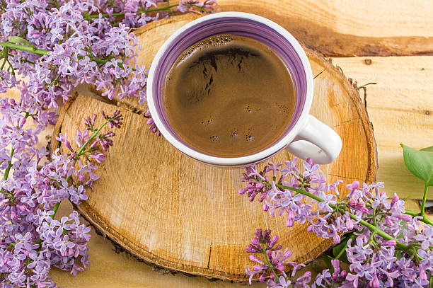istock Cup of coffee and spring flowers 525801652
