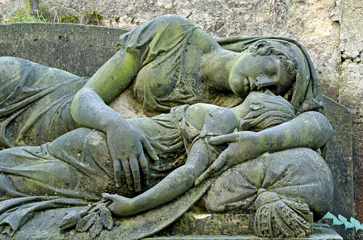 Mourning statue of Mother and child - old cemetery at Krasna Lipa, Czech republic, Europe