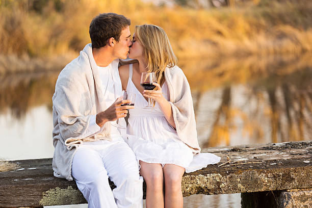 istock couple kissing on a pier 525802817