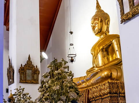 Bangkok, Thailand - December 7, 2015: Big Golden Buddha image inside the hall of Wat Pho public temple, Bangkok, Thailand.