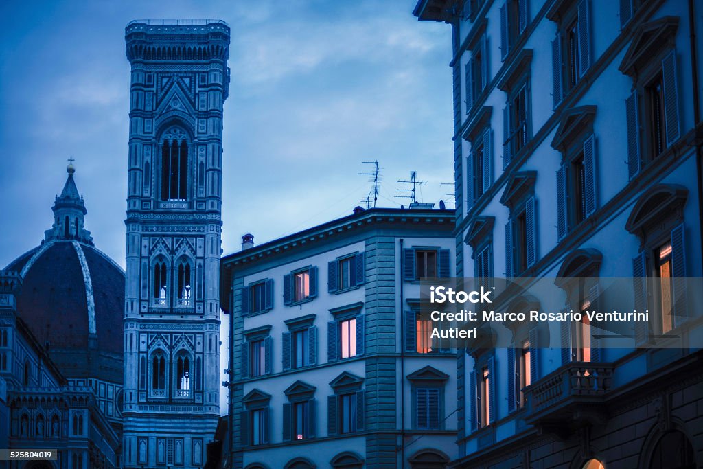 Santa Maria del Fiore at dusk At dusk, the artificial light contrasts beautifully with the cool evening light in the historic centre of Firenze (Florence, Italy). Architectural Dome Stock Photo