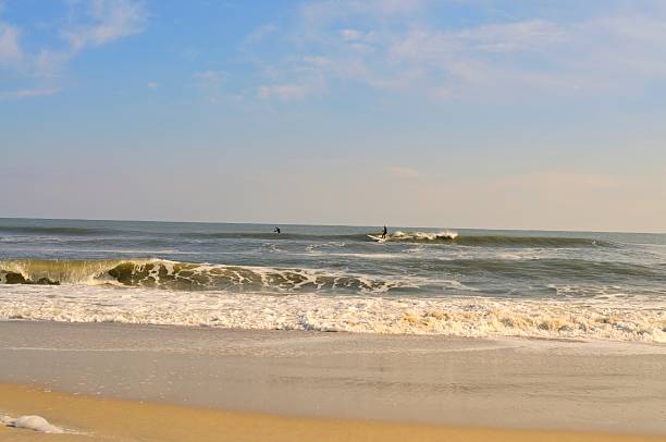 istock Father and Son Paddle Boarding At Assateague On Thanksgiving 525804177