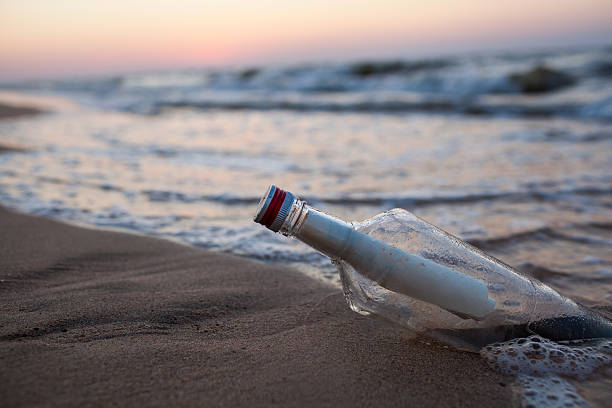 istock Bottle in the sea 525804381