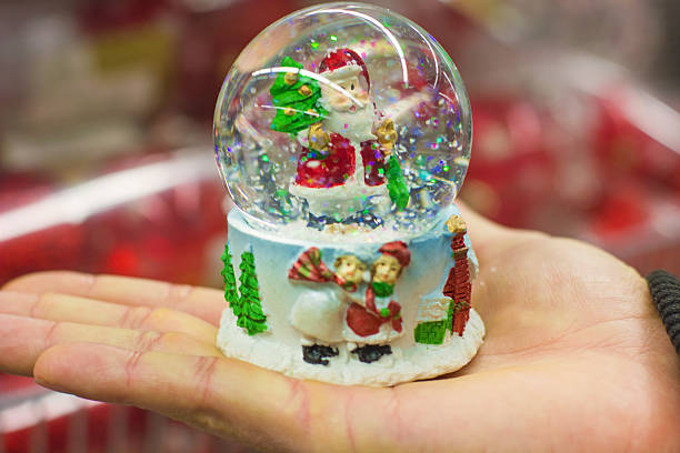 istock Christmas Santa Claus snow globe 525804521
