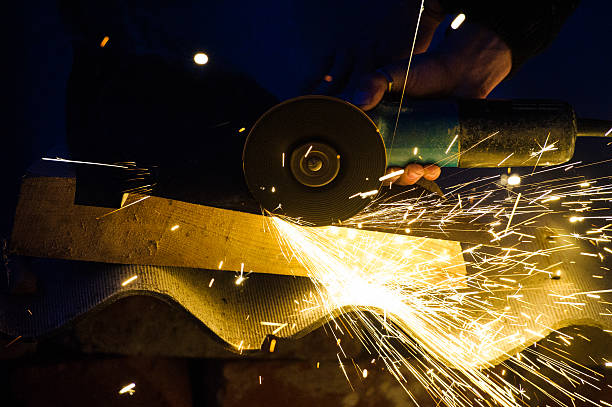 istock Metal grinding on steel pipe close up 525804991