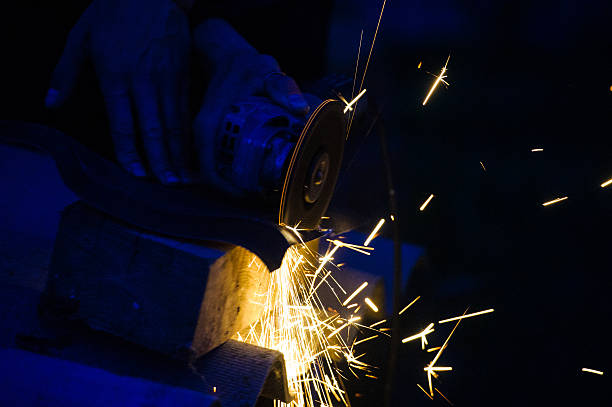 istock Metal grinding on steel pipe close up 525805139