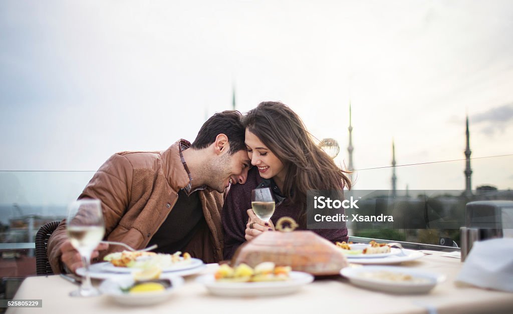 Couple on a romantic date Turkish couple having dinner in the rooftop restaurant in Istanbul. Dinner Stock Photo