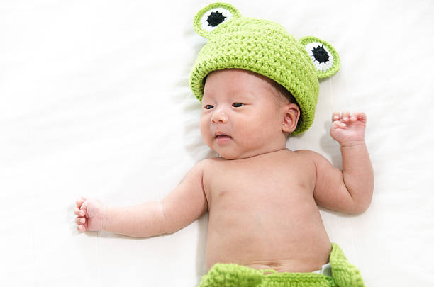 istock baby boy lying in bed 525806585