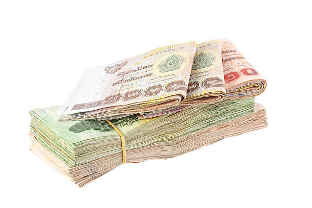 istock Heap of Thai baht banknote isolated on white 525806855