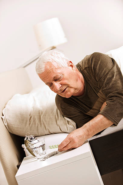 istock Senior man taking pills in the morning 525807425