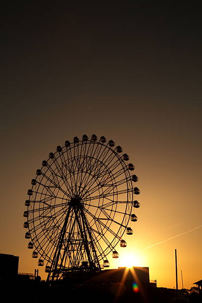 istock Sunset of the Ferris wheel 525807476
